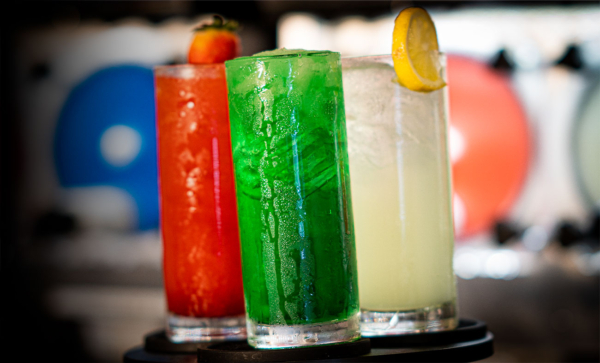 A beautifully arranged assortment of colorful cocktail beverages.